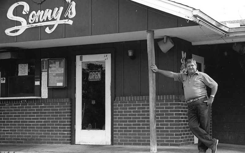 Sonny Tillman standing outside original Sonny's restaurant